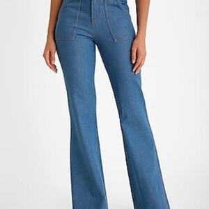 Mid Rise Medium Wash Button Detail '70s Flare Jeans